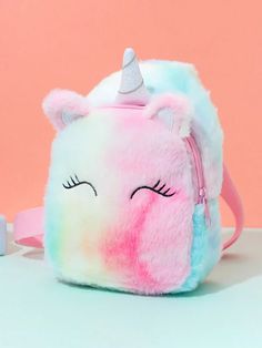 Does your little adventurer crave a cuddly companion and a stylish way to carry their treasures? Look no further than the magical Plush Unicorn Backpack! This adorable bag is more than just a backpack; it's a friend for imaginative play and a trusty carrier for everyday essentials. This whimsical backpack features a so