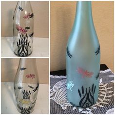 three different vases with dragonflies painted on them and one is blue, the other has pink