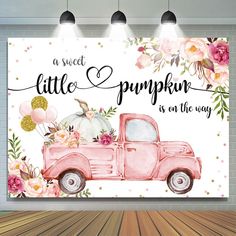 a pink truck with flowers on the side and a sign that says, a sweet little pumpkin is on the way