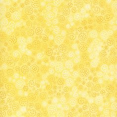 a yellow and white background with small dots on the bottom, in different sizes and colors