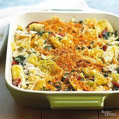 a casserole dish filled with pasta and vegetables