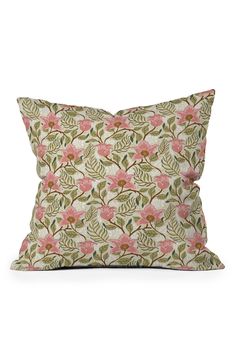 a pink and green floral pillow on a white background