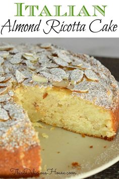 a close up of a cake on a plate with the words italian almond ricotta cake