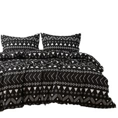 a black and white bed with two pillows on top of it, next to a pillow case