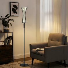 a living room with a chair and lamp in it