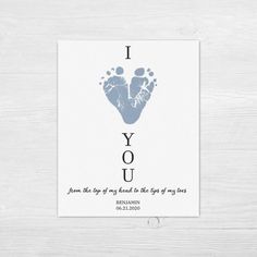 a card with the words i love you and an image of a baby's foot