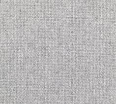 an upholstered gray fabric textured with small squares