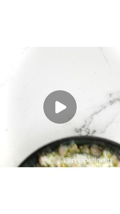 an image of food being cooked in a skillet on the stove top with text overlay