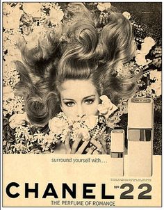 an advertisement for chanel 22 is shown in black and white, with the image of a woman's face surrounded by flowers