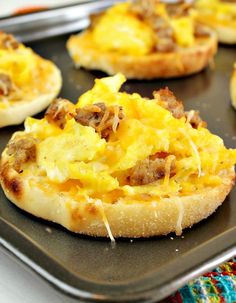 english muffin breakfast pizza on a baking sheet