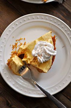 a piece of pie on a plate with a fork next to it and another slice missing