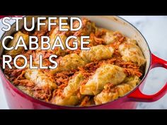 stuffed cabbage rolls in a red pot with the words stuffed cabbage rolls on it's side