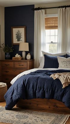 Navy Cream And Brown Bedroom, Dark Wood Blue Bedroom, Blue Bedding Master Room, Blue Bedroom Bedding Ideas, Navy Blue Master Bed Accent Wall, Blue Tan Bedroom Ideas, Rust Navy Bedroom, Blue And White Bedding Bedroom, Wood And Blue Bedroom