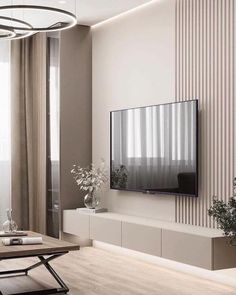 a flat screen tv mounted to the side of a wall in a living room next to a window