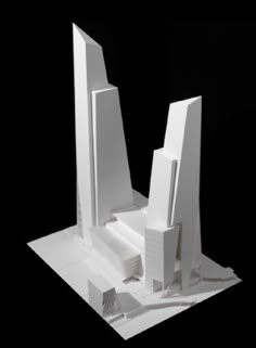 an architectural model of a building on a black background, with only the front section cut out