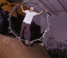 a man riding a skateboard up the side of a ramp