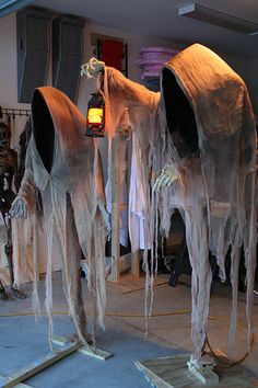 two large white horses made out of cloths