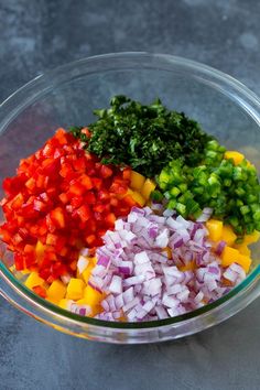 chopped vegetables in a glass bowl on a table