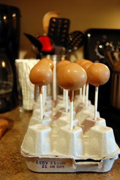 there are several eggs in an egg carton on the counter