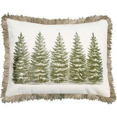 a white pillow with green pine trees on the front and fringe trim around the edges