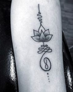 a black and white photo of a lotus tattoo