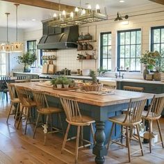 a large kitchen with an island in the middle