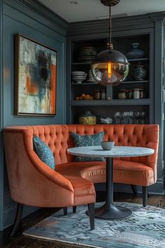 a living room filled with furniture and a round table