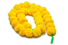 yellow pom poms are arranged in the shape of a letter