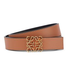 With its filigree lettering and gold-toned finish, it's easy to see why the Anagram is a coveted mainstay in Loewe's collections, and here, it adds a dash of understated polish to this otherwise minimalist belt. The reversible brown and black design is made in Spain from smooth leather, while topstitching exhibits the label's celebrated artisanal vein. | Loewe Anagram reversible leather belt Loewe Anagram, Life Styles, Luxury Belts, Designer Belt, Designer Belts, Belt Style, Reversible Belt, Functional Accessories, Leather Buckle