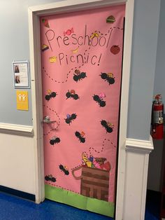 a pink door decorated with pictures and words