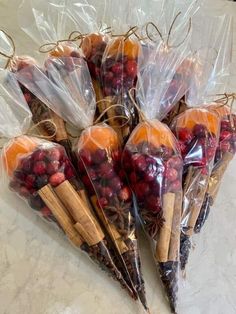 there are many cranberries and cinnamon sticks wrapped in plastic bags on the counter