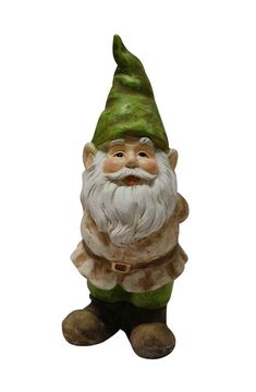 a garden gnome figurine sitting on the ground