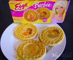 three waffles on a white plate next to a box of eggo babye