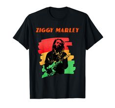 a black t - shirt with the image of ziggy marley holding a guitar