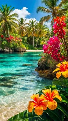 tropical beach with flowers and palm trees on the shore, surrounded by clear blue water