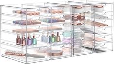 three clear shelves filled with cosmetics and beauty products