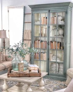 a living room filled with furniture and bookshelves