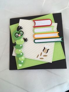 a close up of a book with a caterpillar on it