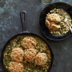 two skillets filled with chicken and vegetable stew