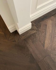 an image of a wood floor with white trim