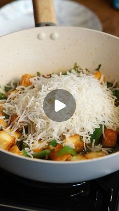 a pan filled with food sitting on top of a stove