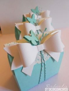 a blue box with some white bows on it