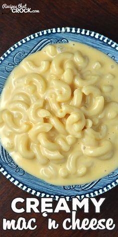 creamy mac n cheese in a blue and white bowl with the words creamy mac n cheese