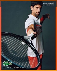 a man holding a tennis racquet on top of a tennis ball racket