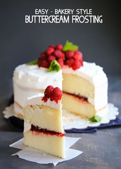 two pieces of white cake with raspberries on top and one slice cut out