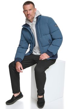 Stretch fabric and a quilted body mean all-day comfort in a versatile jacket. 27" length Stand collar Water-resistant Lined, with 50% down, 50% feather fill 88% nylon, 12% spandex Machine wash, tumble dry Imported Sporty Down Outerwear With Padded Collar, Weatherproof Long Sleeve Down Outerwear, Sporty Down Puffer Jacket With Ribbed Cuffs, Weatherproof Down Outerwear With Long Sleeves, Functional Fall Puffer Quilted Jacket, Fall Functional Puffer Quilted Jacket, Weatherproof Down Outerwear, Functional Fall Quilted Puffer Jacket, Sporty Quilted Puffer Jacket For Winter