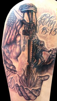 the back of a man's arm with an american flag on it and two hands holding