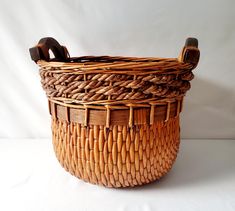 a woven basket sitting on top of a white table