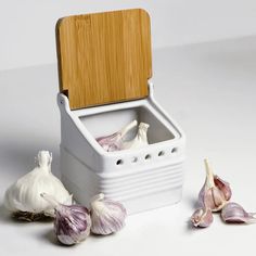 garlic cloves are gathered around an ice chest