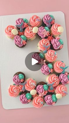 cupcakes are arranged in the shape of the letter e